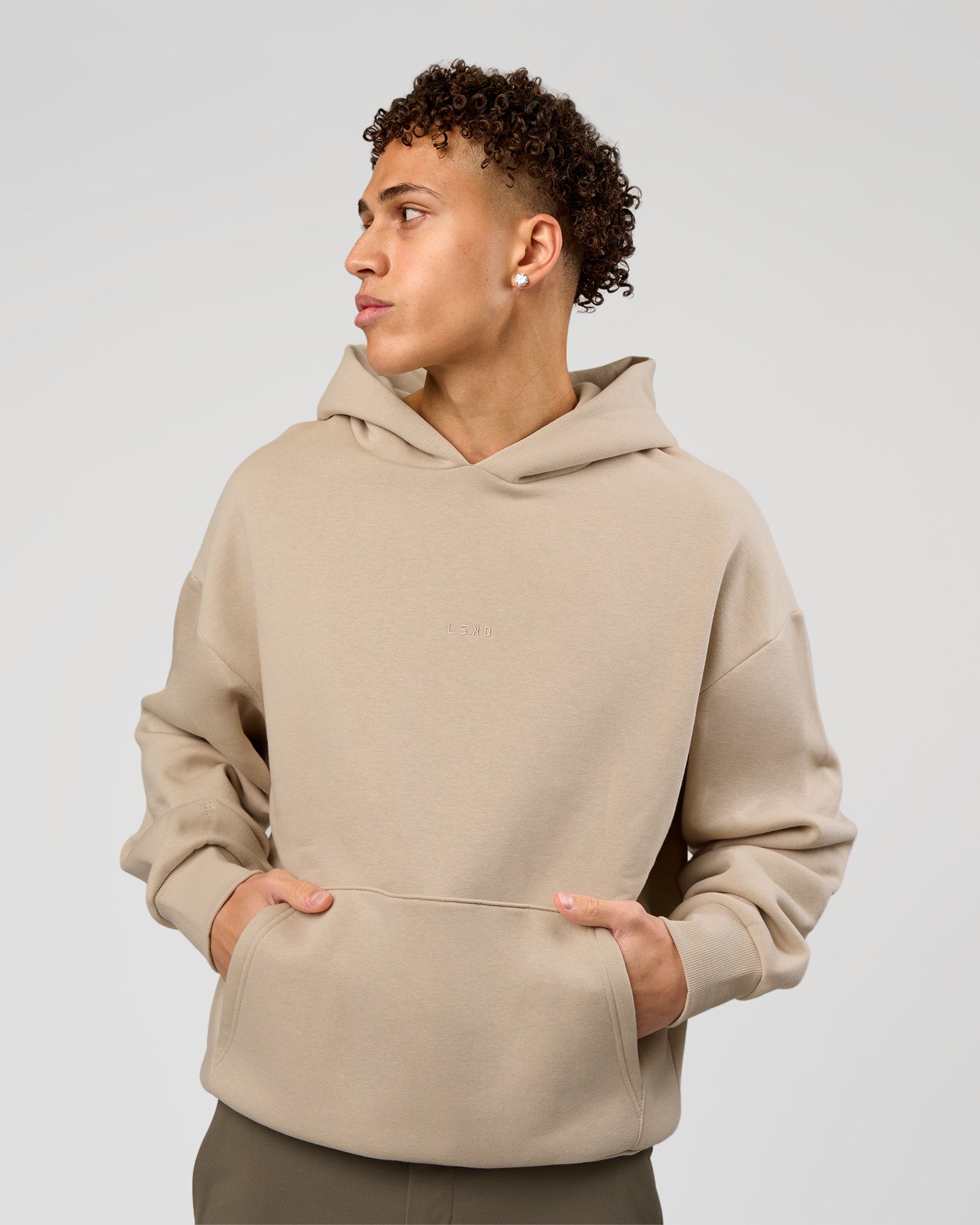 Man wearing Base Oversized Hoodie - Shale Beige | Model:Leandro | Size:M |