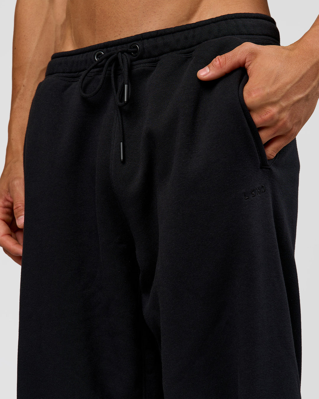 Man wearing Base Wide Leg Track Pant - Black | Model:Albert | Size:M |