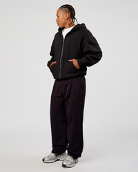 Man wearing Base Zip Through Oversized Hoodie - Black | Model:Malebo | Size:M