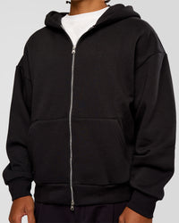 Man wearing Base Zip Through Oversized Hoodie - Black | Model:Malebo | Size:M