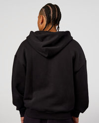 Man wearing Base Zip Through Oversized Hoodie - Black | Model:Malebo | Size:M