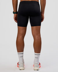 Man wearing BaseTech 8" Shorts - Black | Model:George | Size:M