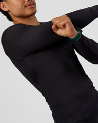 Man wearing BaseTech Long Sleeve Tee - Black | Model:George | Size:M