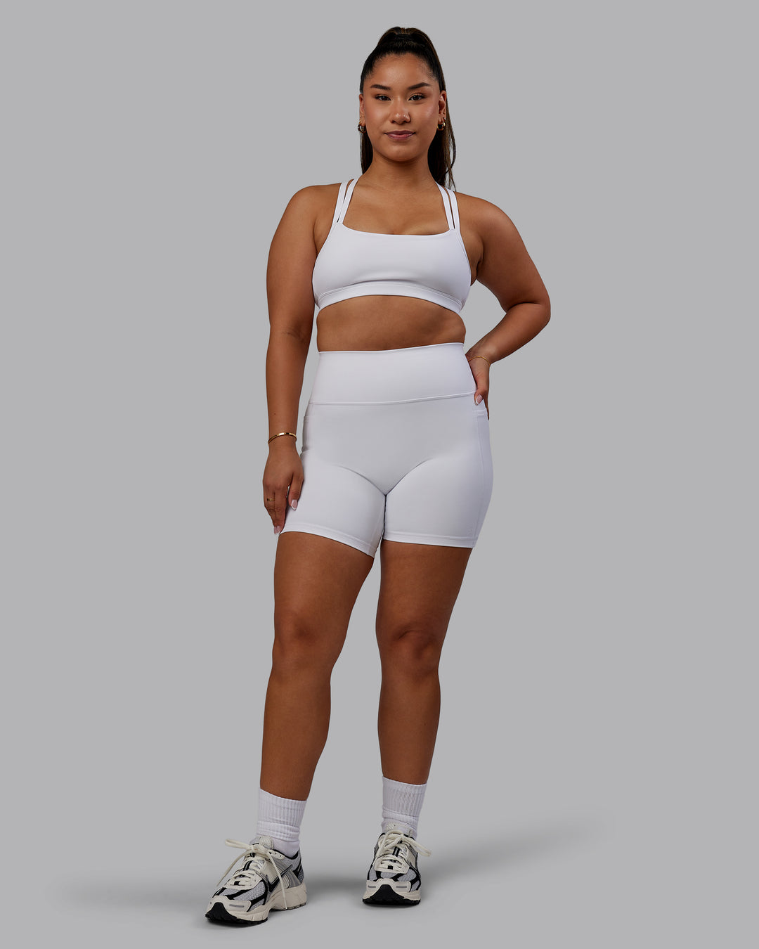Woman wearing Bree Masters Fusion Ultra High-Rise 6&quot; Short Pockets - White