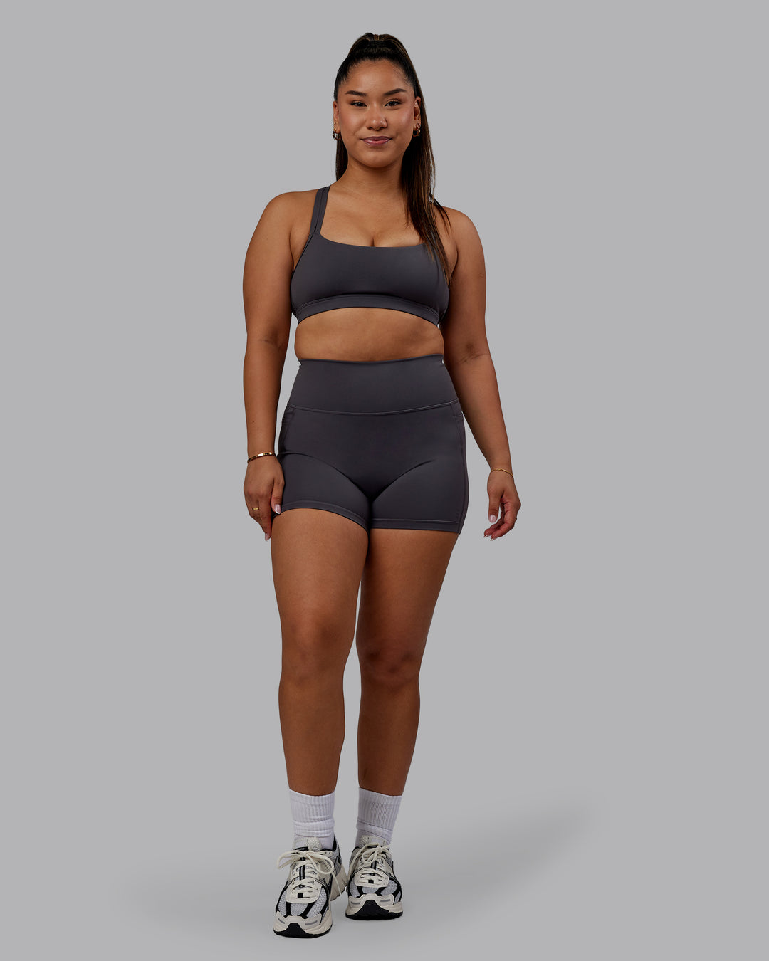 Woman wearing Bree Masters Fusion Ultra High-Rise 4&quot; Short Pockets - Stormy