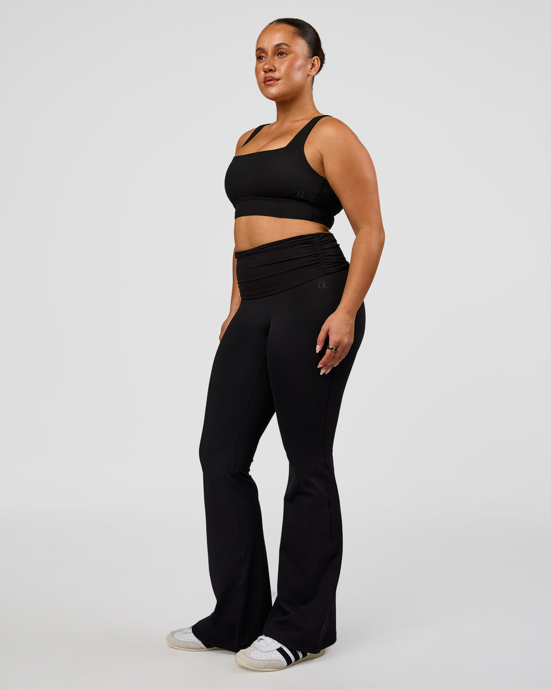 Woman wearing CF Fold Over High-Rise Flared Legging - Black | Model:Simmy | Size:M