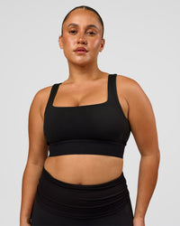 Woman wearing CF Train Hard Sports Bra - Black | Model:Simmy | Size:M