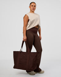 Woman wearing CF Unisex Oversized Heavyweight Boxed Tank - Clay-CF Move Through It | Model:Simmy | Size:M