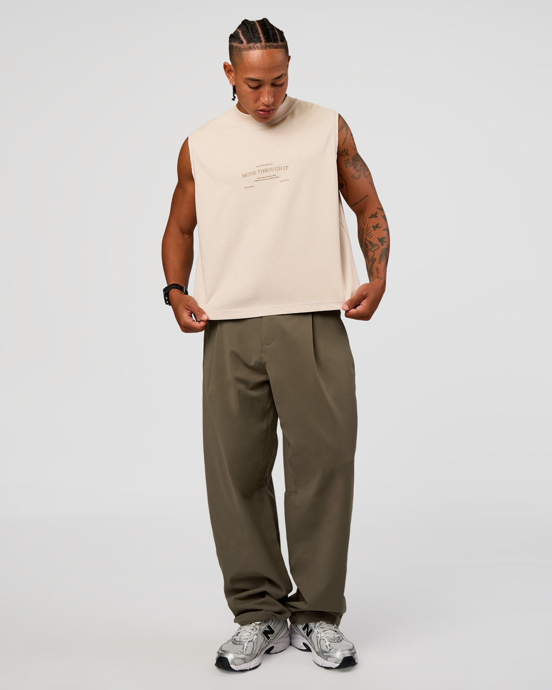 Man wearing CF Unisex Oversized Heavyweight Boxed Tank - Clay-CF Move Through It | Model:Malebo | Size:M