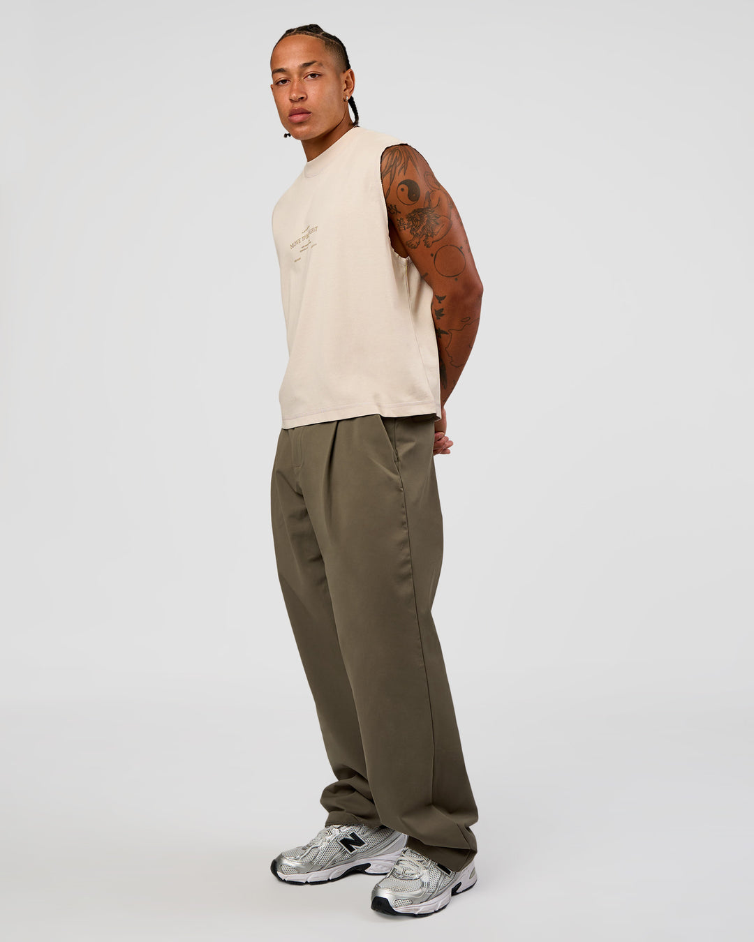 Man wearing CF Unisex Oversized Heavyweight Boxed Tank - Clay-CF Move Through It | Model:Malebo | Size:M