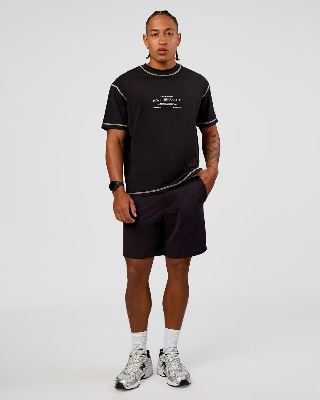 Man wearing CF Unisex Oversized Heavyweight FLXCotton Tee - Black-CF Move Through It | Model:Malebo | Size:M