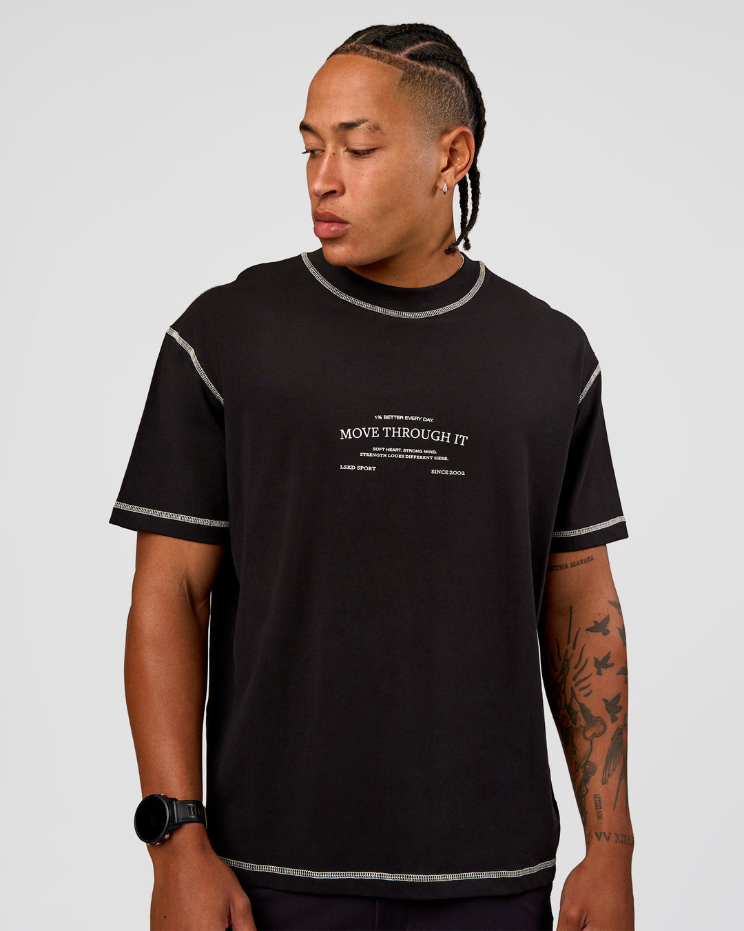 Man wearing CF Unisex Oversized Heavyweight FLXCotton Tee - Black-CF Move Through It | Model:Malebo | Size:M