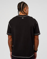 Man wearing CF Unisex Oversized Heavyweight FLXCotton Tee - Black-CF Move Through It | Model:Malebo | Size:M