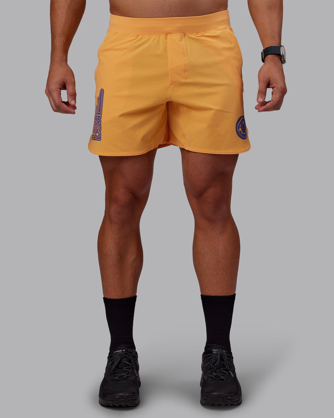 Man wearing CFT BNE 25 Lift 6&quot; Short - Warm Apricot-Purple Opulence | Model:Jaiden | Size:M