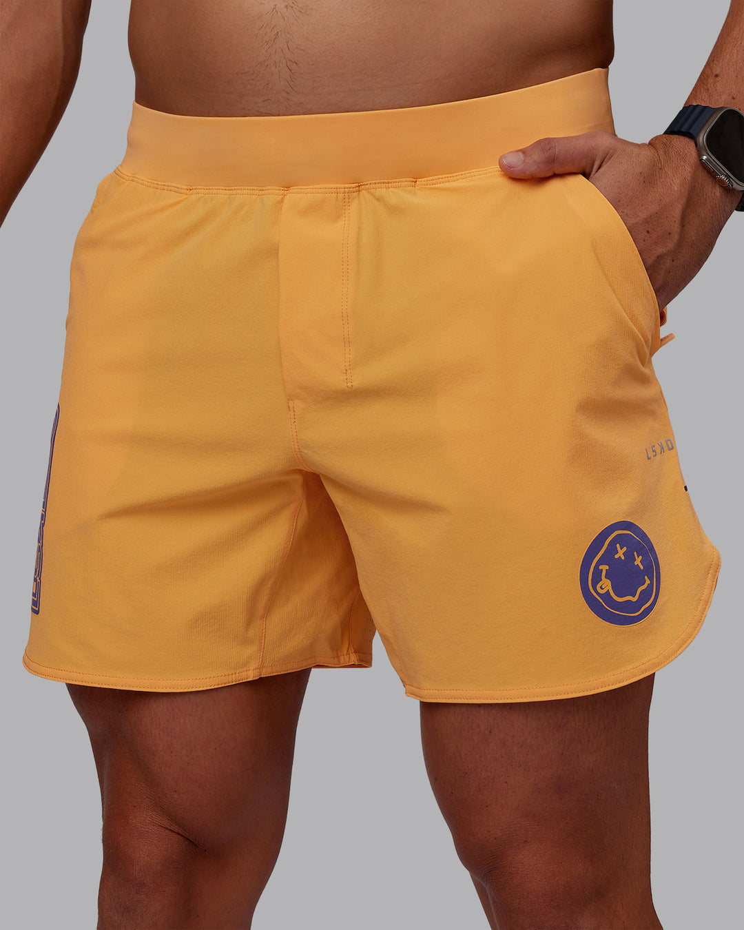 Man wearing CFT BNE 25 Lift 6&quot; Short - Warm Apricot-Purple Opulence | Model:Jaiden | Size:M