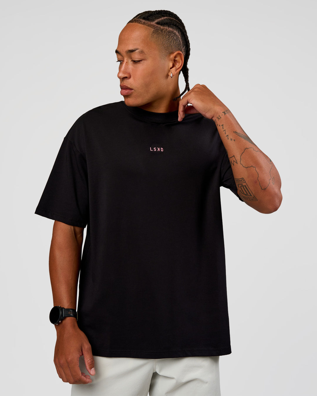 Man wearing CFT BNE 26 FLXCotton Oversized Tee in Black | Model:Malebo | Size:M