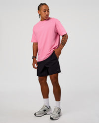 Man wearing CFT BNE 26 FLXCotton Oversized Tee in Candy Pink | Model:Malebo | Size:M
