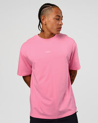Man wearing CFT BNE 26 FLXCotton Oversized Tee in Candy Pink | Model:Malebo | Size:M