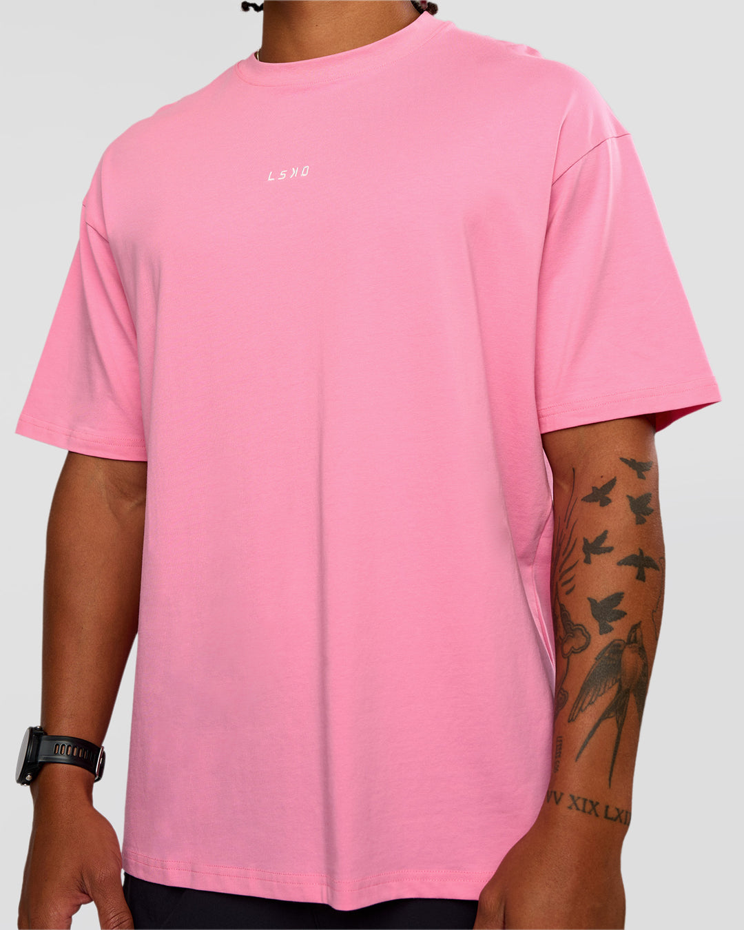 Man wearing CFT BNE 26 FLXCotton Oversized Tee in Candy Pink | Model:Malebo | Size:M