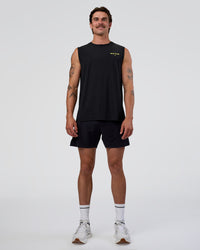 Man wearing Cadence RUN CLUB Muscle Tank - Black-Yellow Fizz | Model:Konnor | Size:M