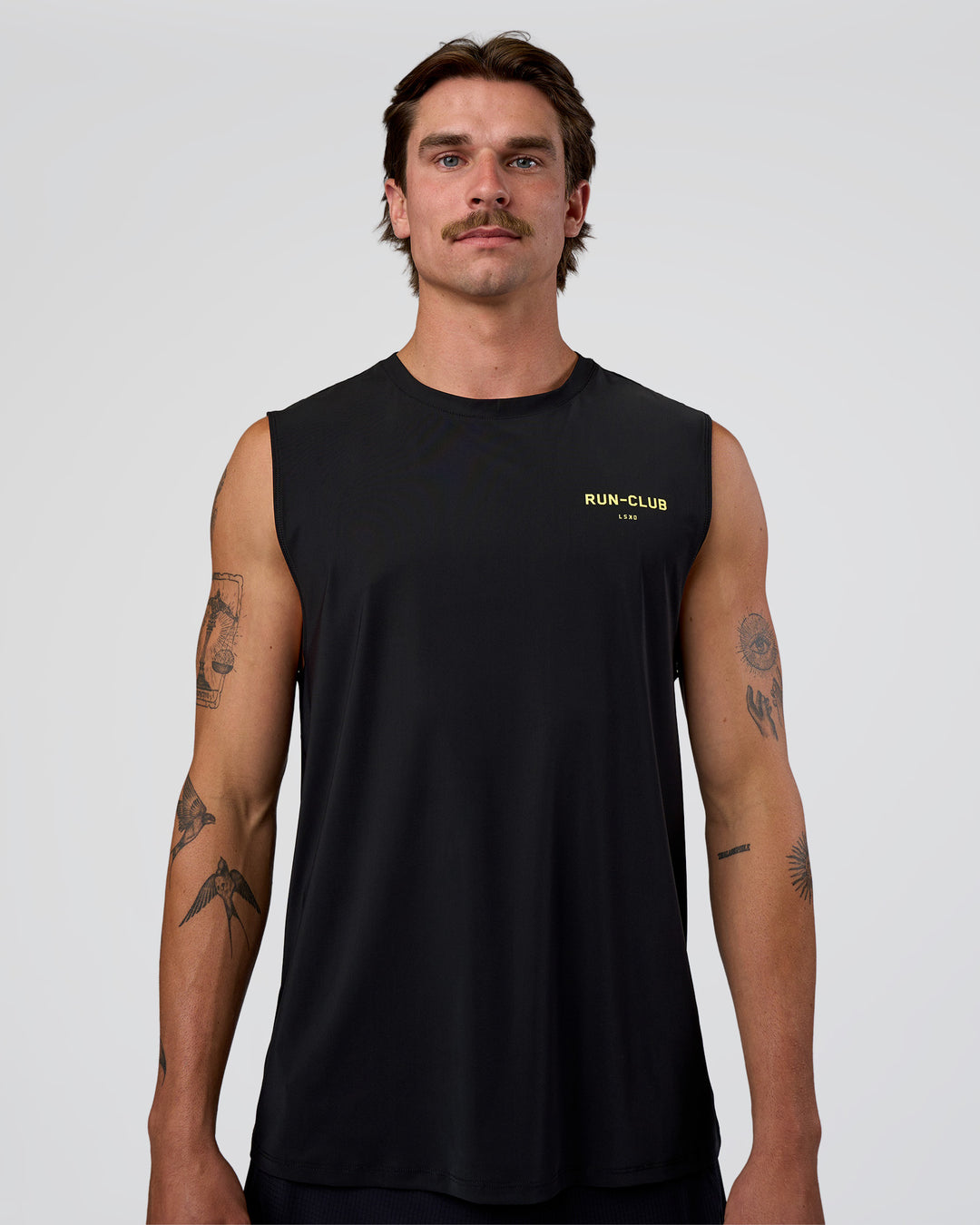 Man wearing Cadence RUN CLUB Muscle Tank - Black-Yellow Fizz | Model:Konnor | Size:M