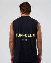Man wearing Cadence RUN CLUB Muscle Tank - Black-Yellow Fizz | Model:Konnor | Size:M