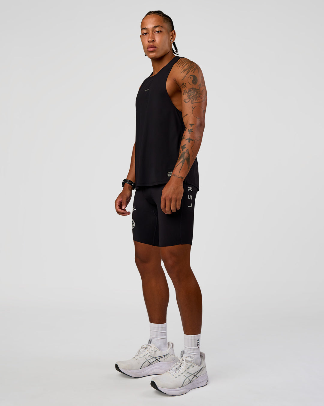 Man wearing Cadence Run Club Script Values Tank - Black-Alloy | Model:Malebo | Size:M