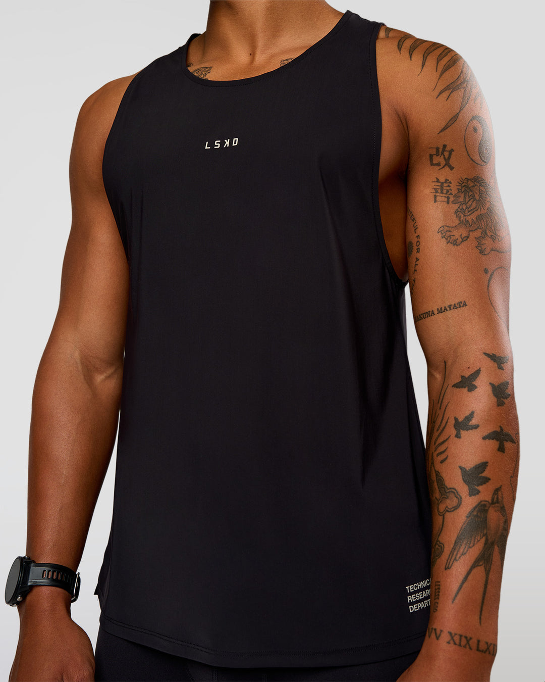 Man wearing Cadence Run Club Script Values Tank - Black-Alloy | Model:Malebo | Size:M