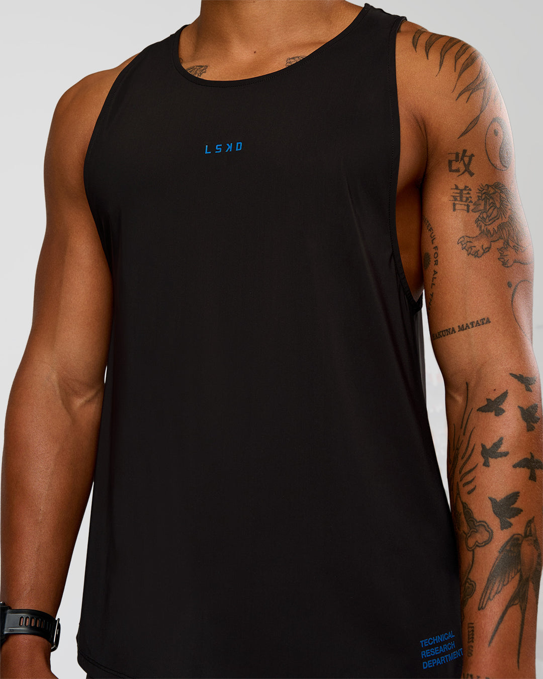Man wearing Cadence Run Club Script Values Tank - Black-Palace Blue | Model:Malebo | Size:M