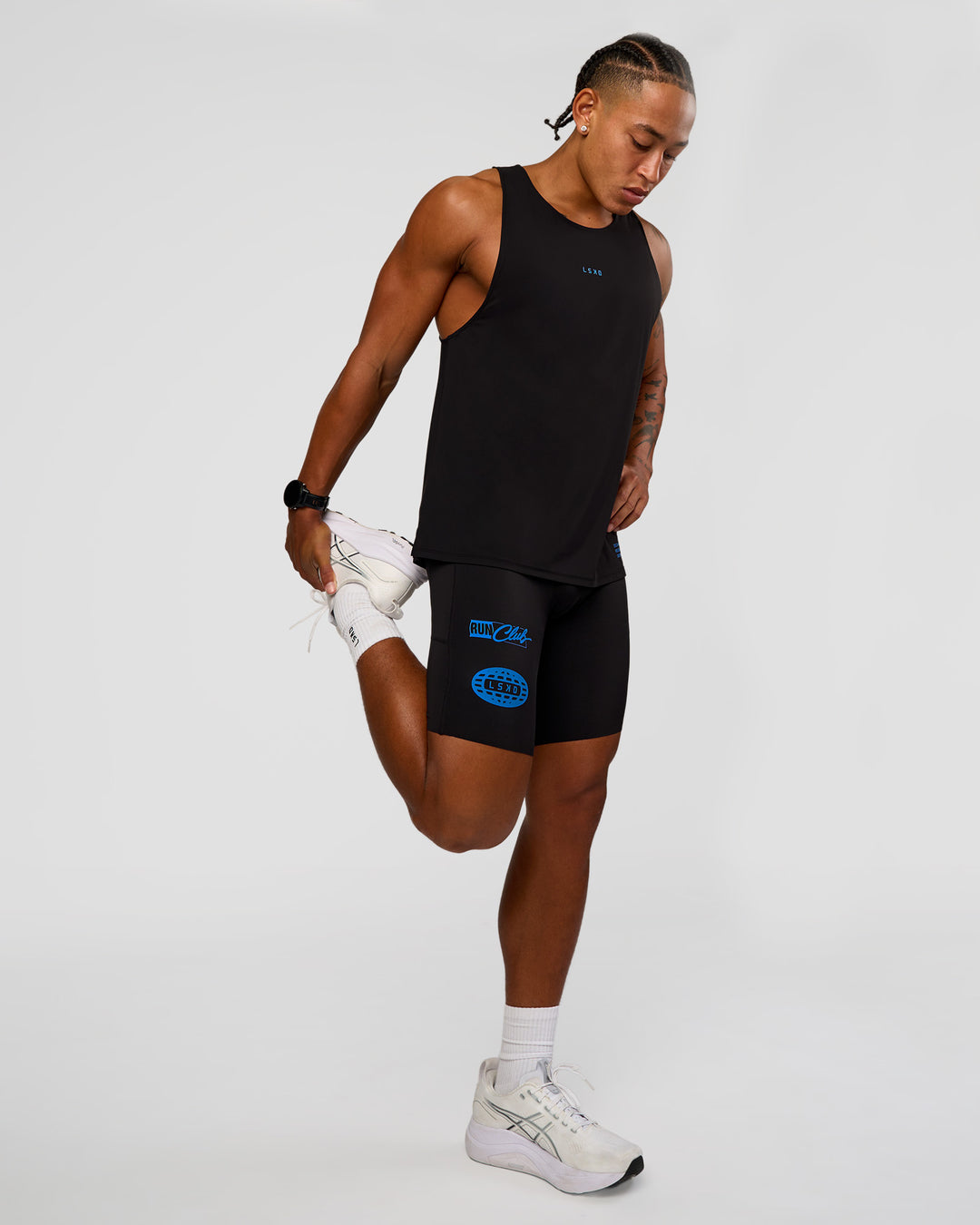 Man wearing Cadence Run Club Script Values Tank - Black-Palace Blue | Model:Malebo | Size:M