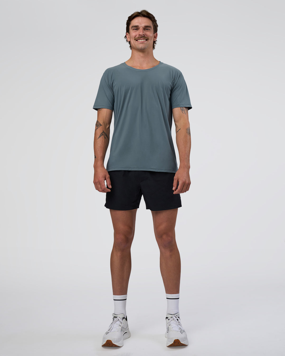 Man wearing Cadence Swift Tee - Blue Mirage | Model:Konnor | Size:M