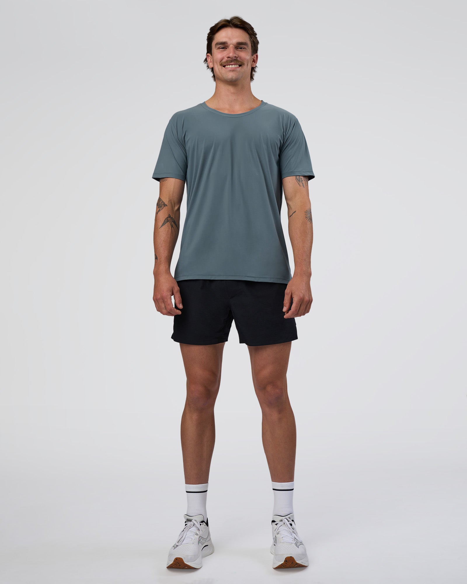 Man wearing Cadence Swift Tee - Blue Mirage | Model:Konnor | Size:M