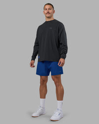 Man wearing Cali FLXCotton Oversized Long Sleeve Tee - Black Washed | Model:Jaiden | Size:M