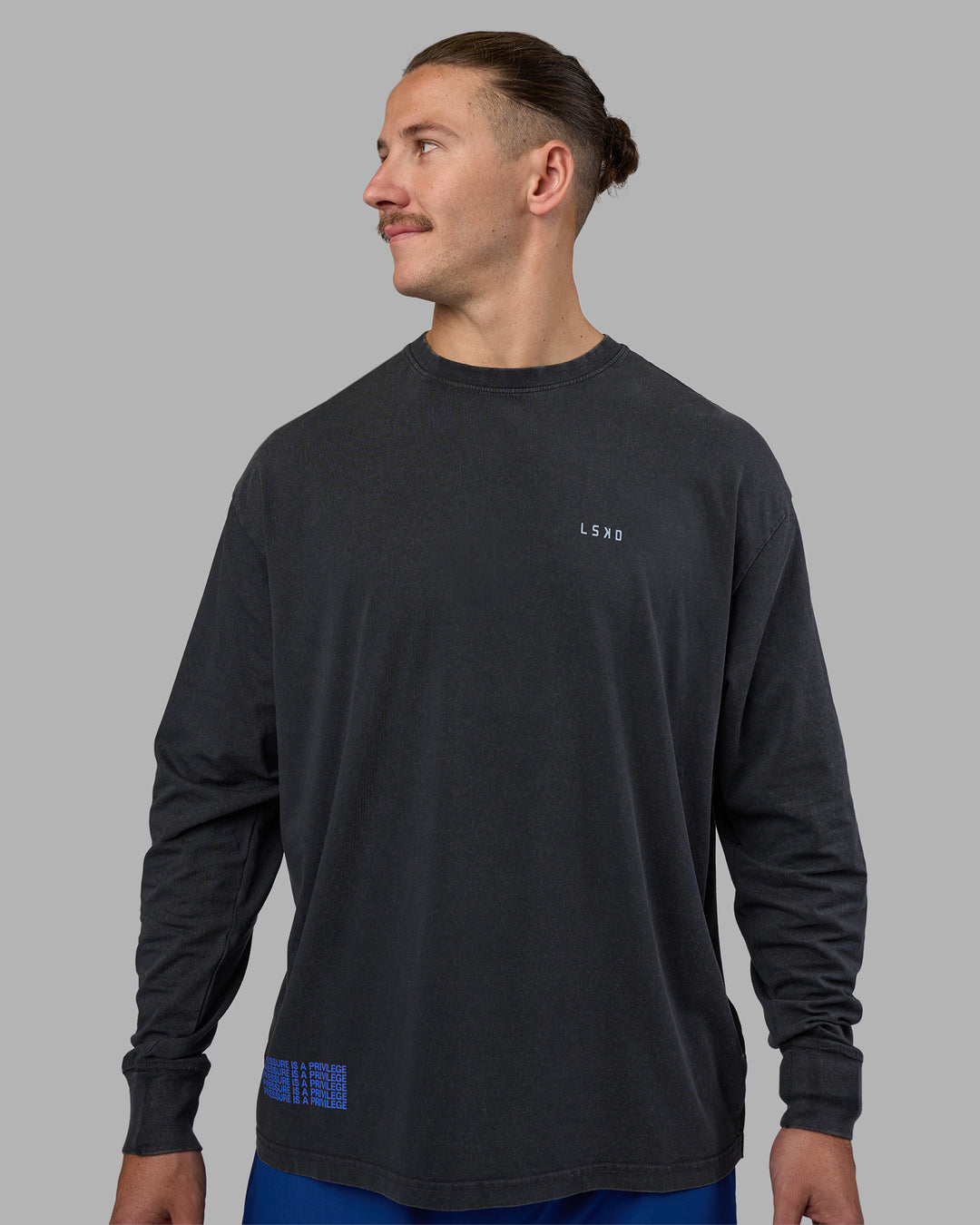 Man wearing Cali FLXCotton Oversized Long Sleeve Tee - Black Washed | Model:Jaiden | Size:M