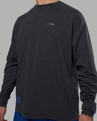 Man wearing Cali FLXCotton Oversized Long Sleeve Tee - Black Washed | Model:Jaiden | Size:M