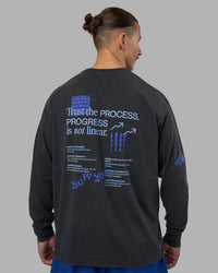 Man wearing Cali FLXCotton Oversized Long Sleeve Tee - Black Washed | Model:Jaiden | Size:M