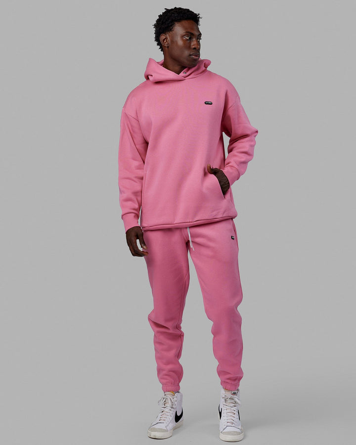 Man wearing Unisex Capsule Track Pants - Pink Rose