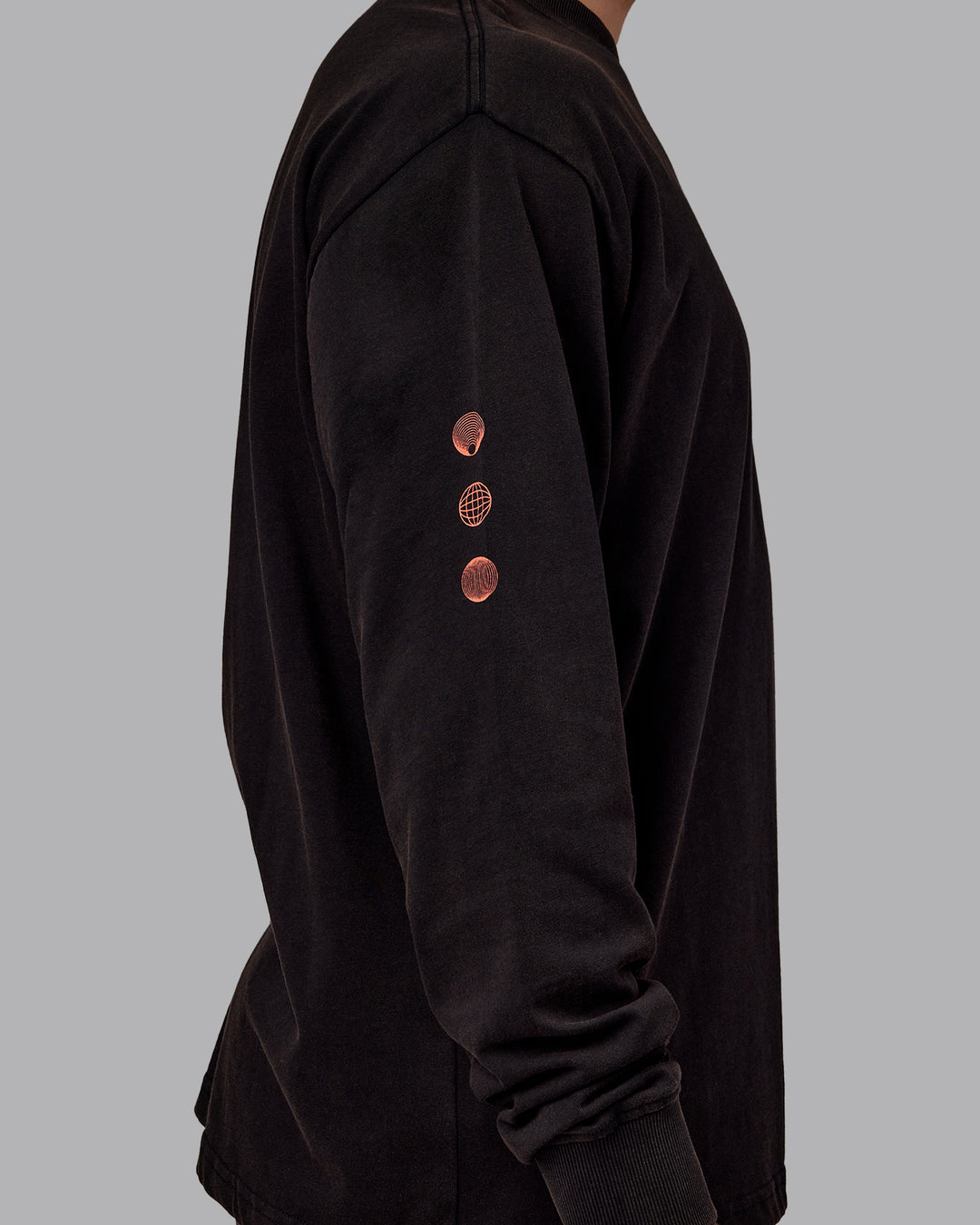 Man wearing Chrome Washed Heavyweight Oversized Long Sleeve Tee - Black-Ultra Orange | Model:Jaiden | Size:M