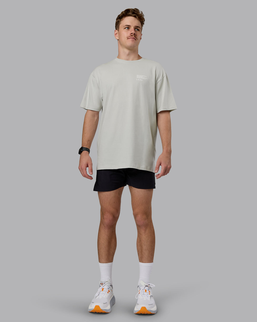 Man wearing Coffee Run FLXCotton Oversized Tee - Digital Mist-Scarlet | Model:Cameron | Size:M