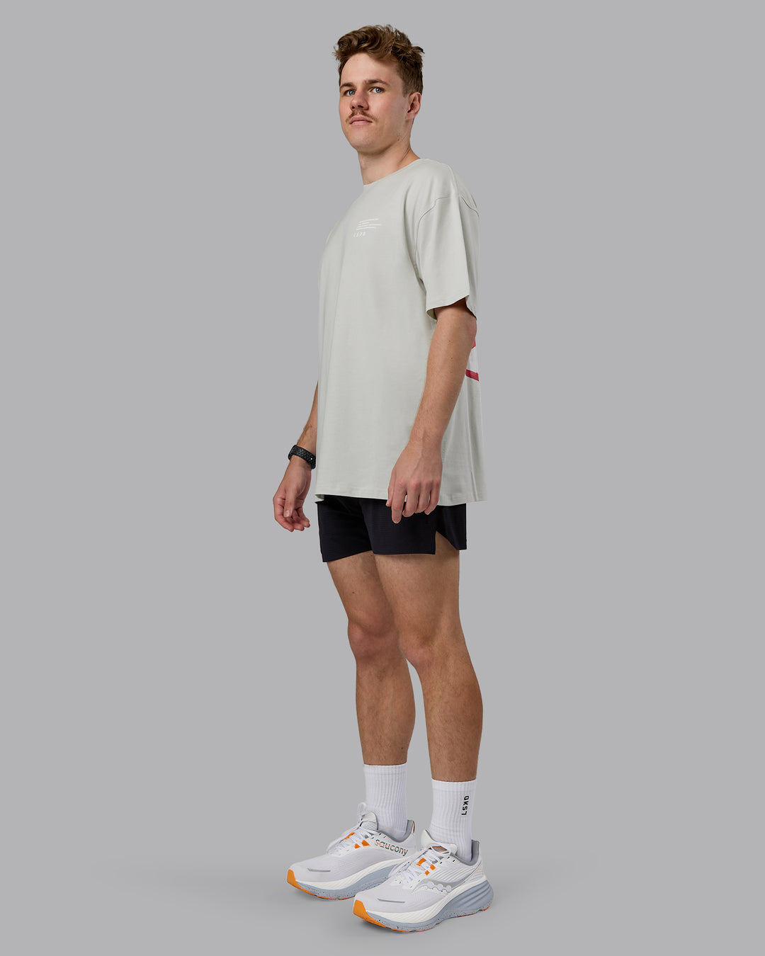 Man wearing Coffee Run FLXCotton Oversized Tee - Digital Mist-Scarlet | Model:Cameron | Size:M