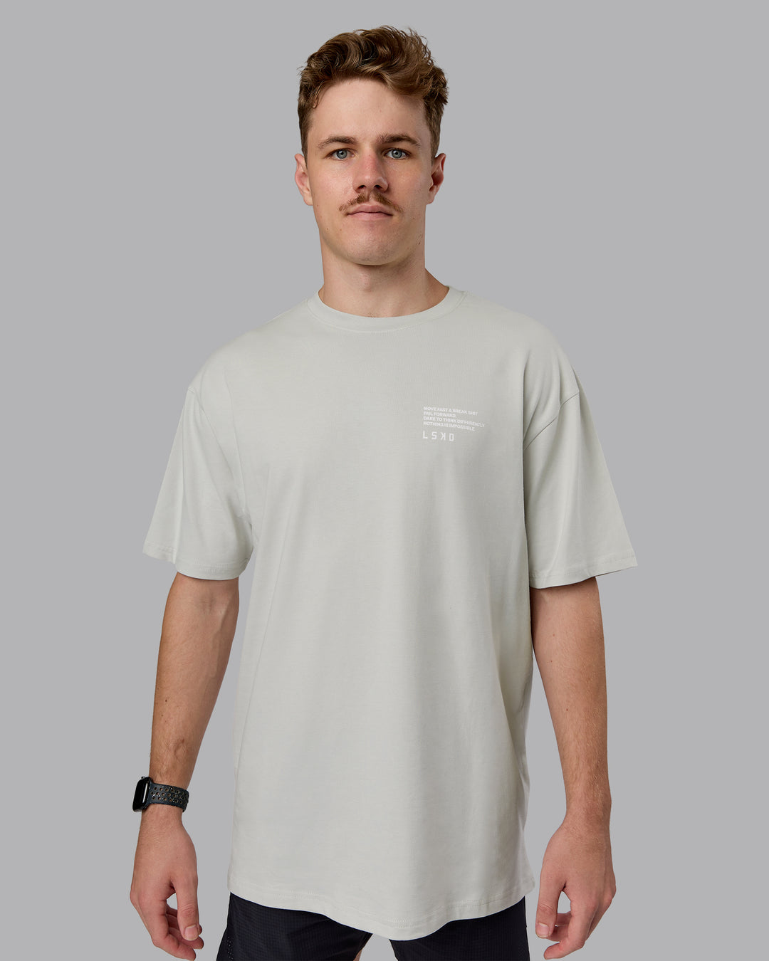 Man wearing Coffee Run FLXCotton Oversized Tee - Digital Mist-Scarlet | Model:Cameron | Size:M