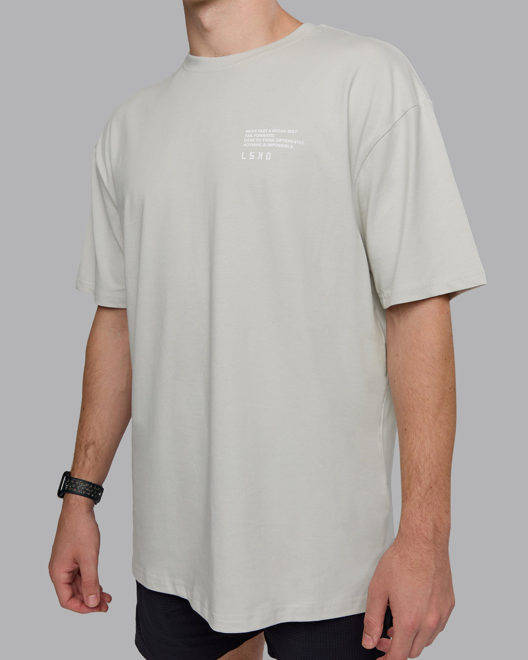 Man wearing Coffee Run FLXCotton Oversized Tee - Digital Mist-Scarlet | Model:Cameron | Size:M