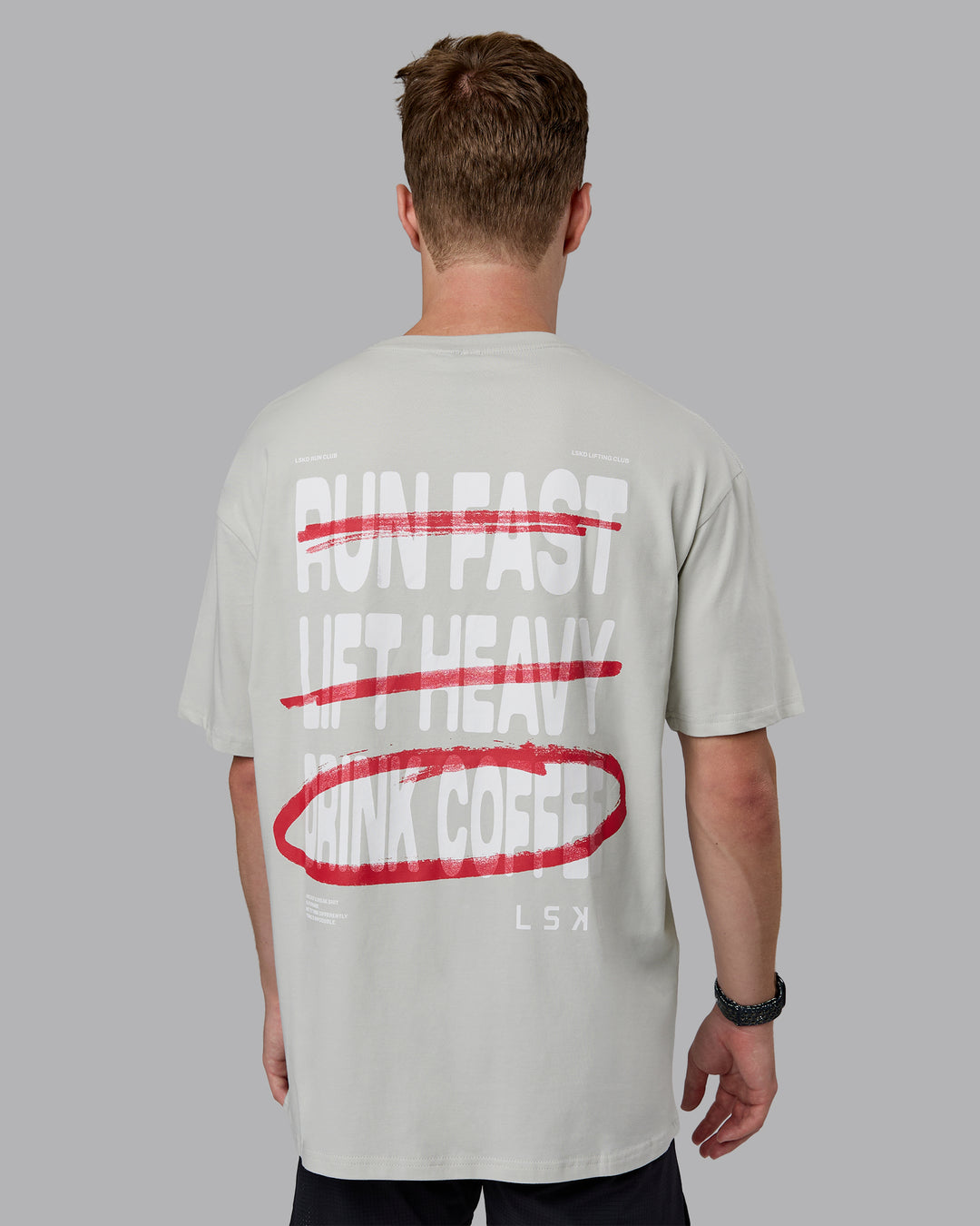 Man wearing Coffee Run FLXCotton Oversized Tee - Digital Mist-Scarlet | Model:Cameron | Size:M