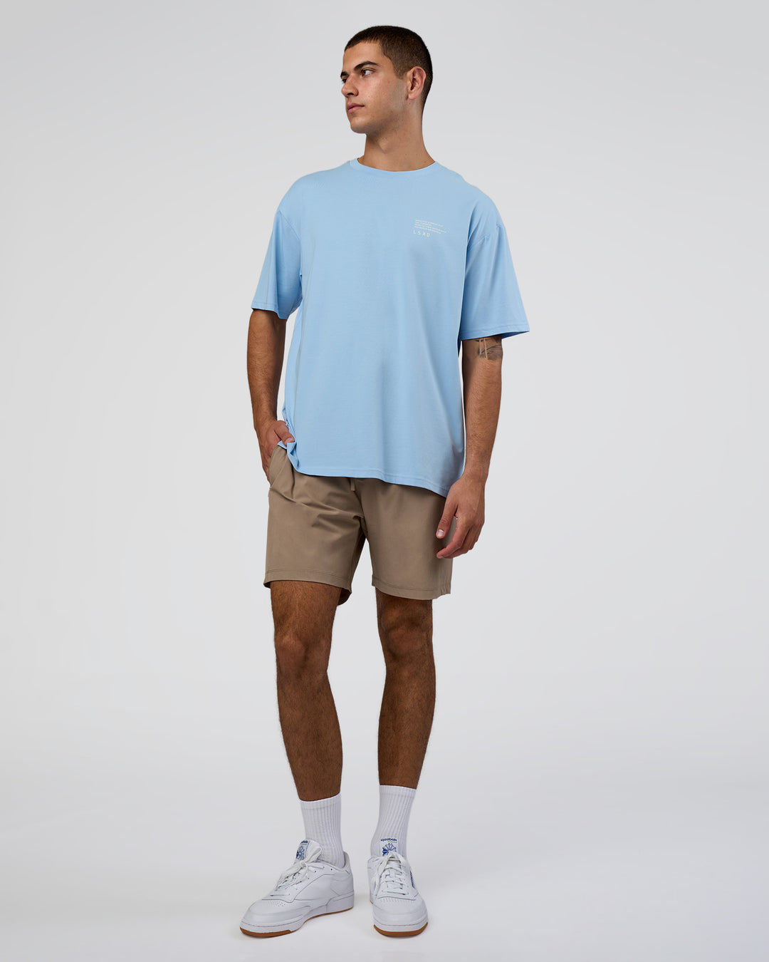 Man wearing Coffee Run FLXCotton Oversized Tee - Open Air-White | Model:Zoran | Size:L