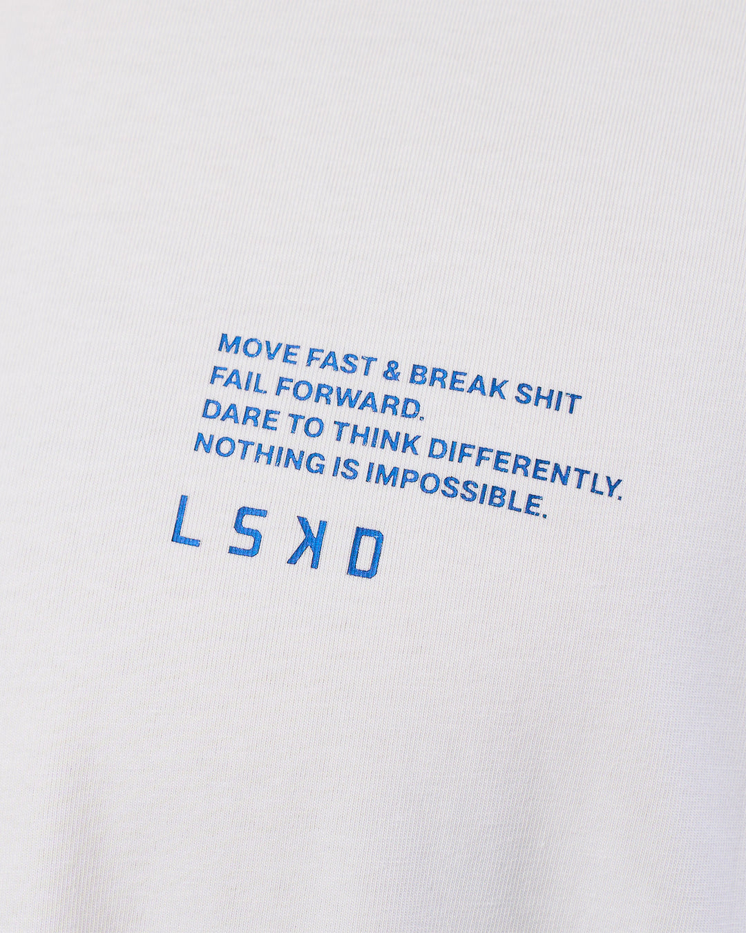 Man wearing Coffee Run FLXCotton Oversized Tee - White-Electric Indigo | Model:Zoran | Size:L