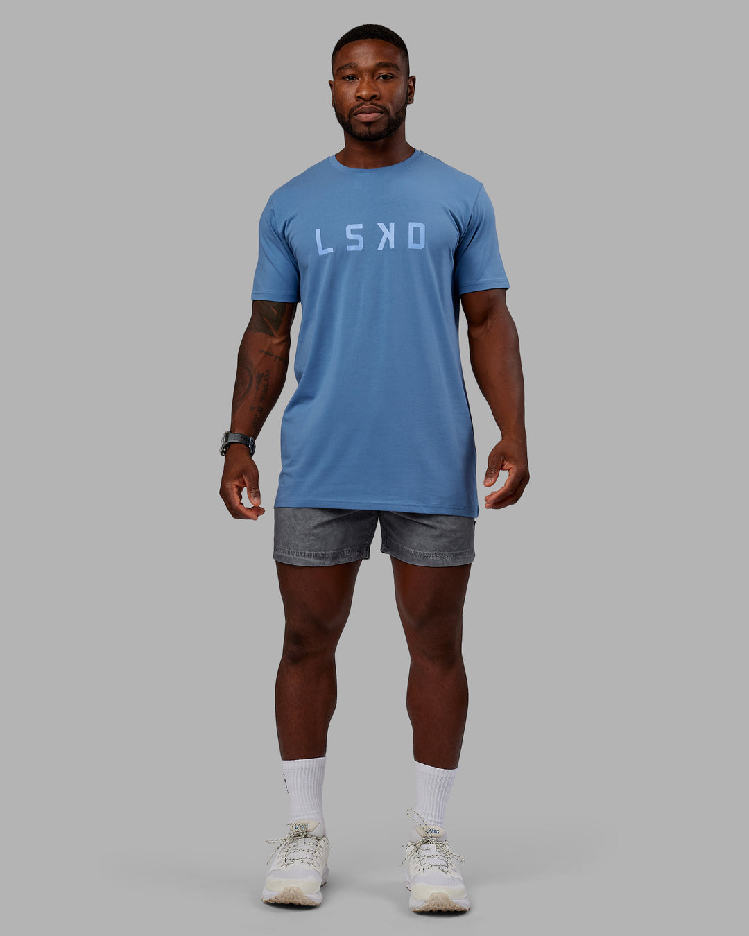 Man wearing Washed Daily 5" Shorts - Circular Grey