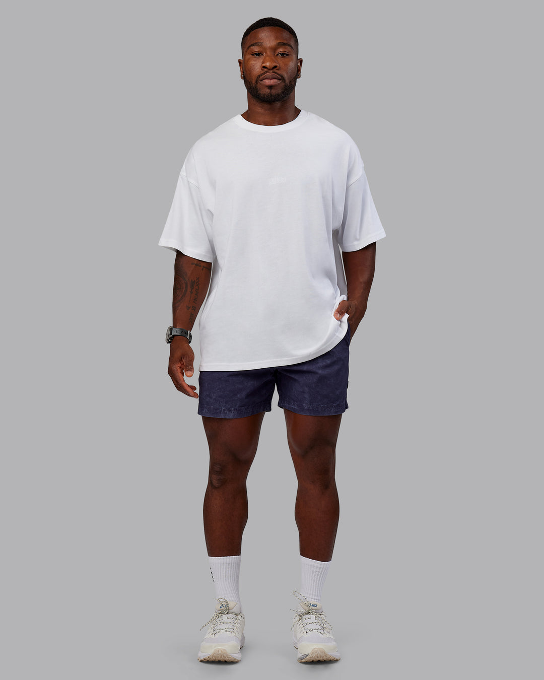 Man wearing Washed Daily 5" Shorts - Midnight Blue