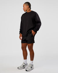 Man wearing Daily 5" Short 2.0 in Black | Model:Malebo | Size:M