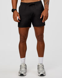 Man wearing Daily 5" Short 2.0 in Black | Model:Malebo | Size:M