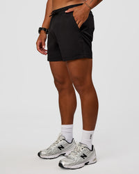 Man wearing Daily 5" Short 2.0 in Black | Model:Malebo | Size:M